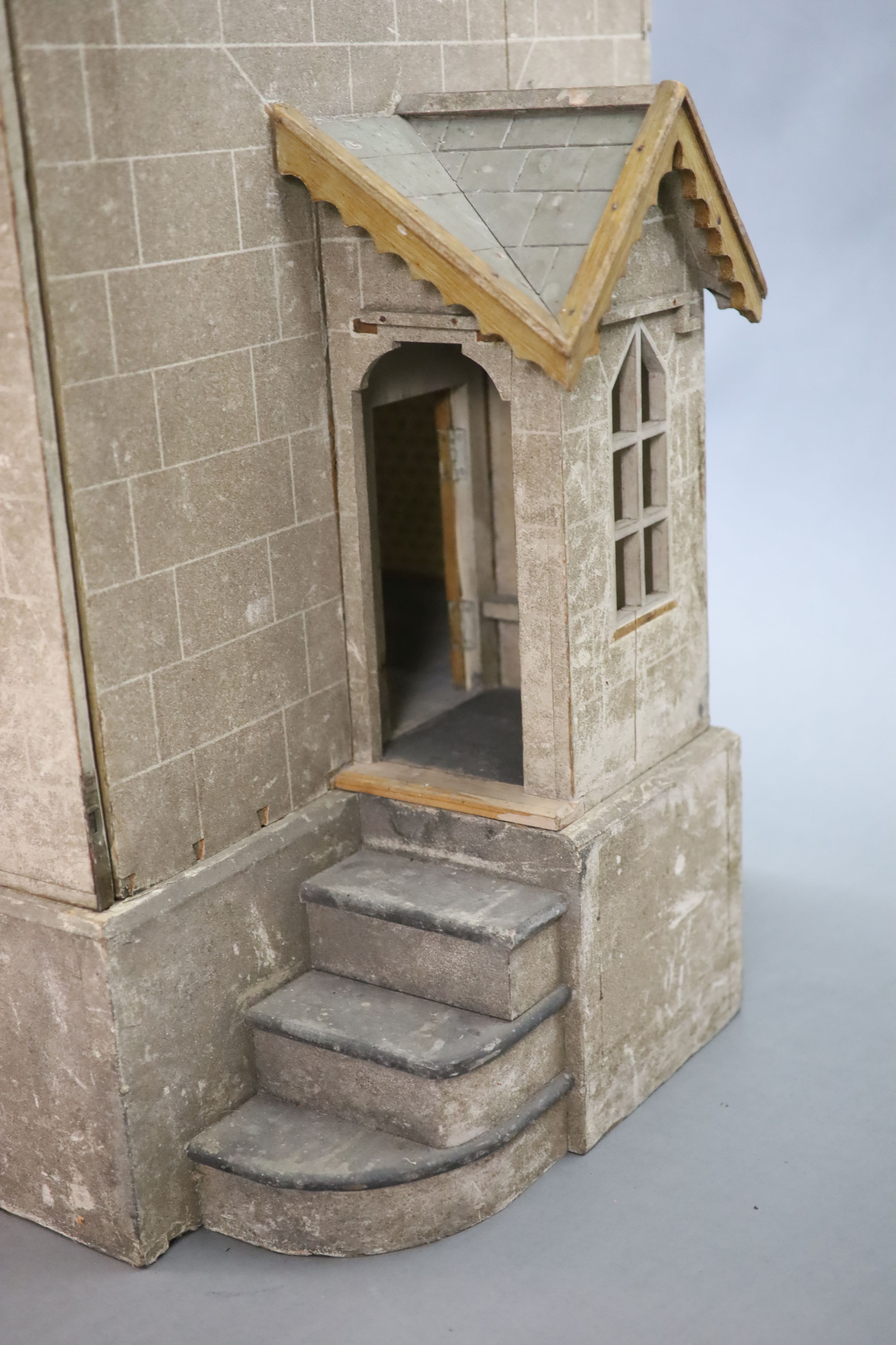 An unusually large painted pine doll's house, modelled upon a Victorian lodge house, Estate Carpenter made, Lake District width 198cm height 156cm